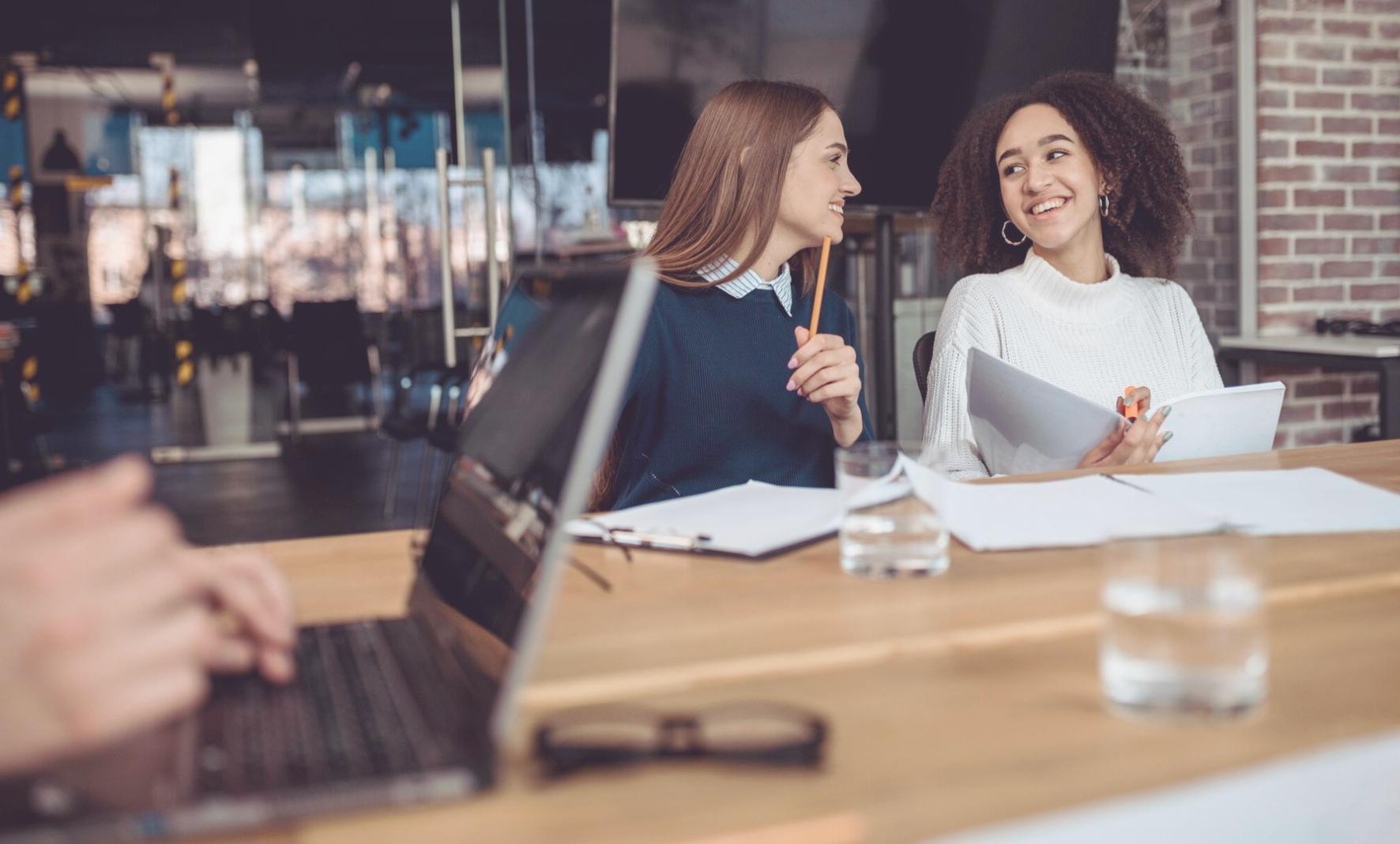 Business owner reviewing financial reports and planning documents