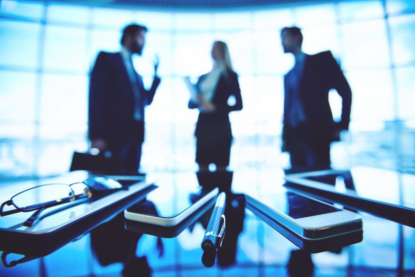 Early workshop session with aspiring franchise owners reviewing financial documents